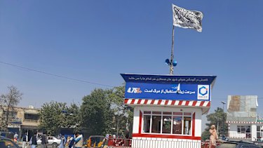 A Taliban flag flies in the main square of Kunduz city after fighting between Taliban and Afghan security forces, in Kunduz, Afghanistan.