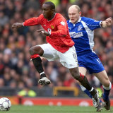 Dwight Yorke in action during his career at Manchester United.