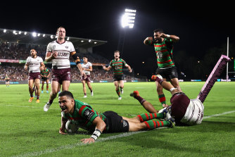 South Sydney’s Cody Walker dives over for a try to celebrate his 150th NRL match.