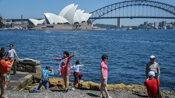 Tourists at Sydney's Mrs Macquarie's Chair.