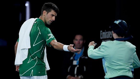 Djokovic took time out to fix his contact lenses.