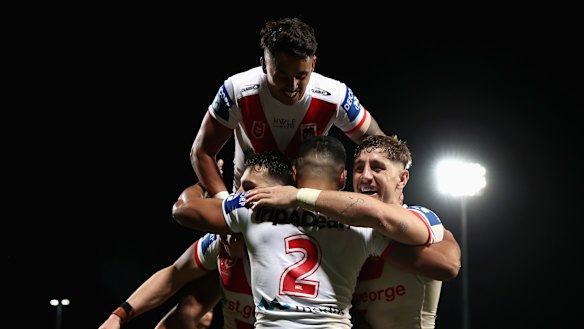 Mathew Feagai of the Dragons celebrates scoring a try late in the game.