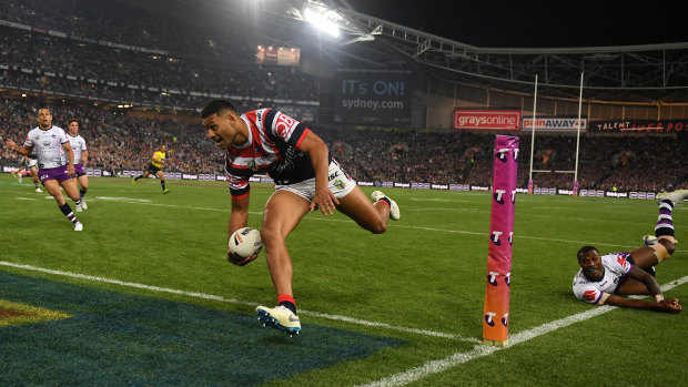 Bursting out of the gates: Daniel Tupou crosses in the first half for the Roosters.