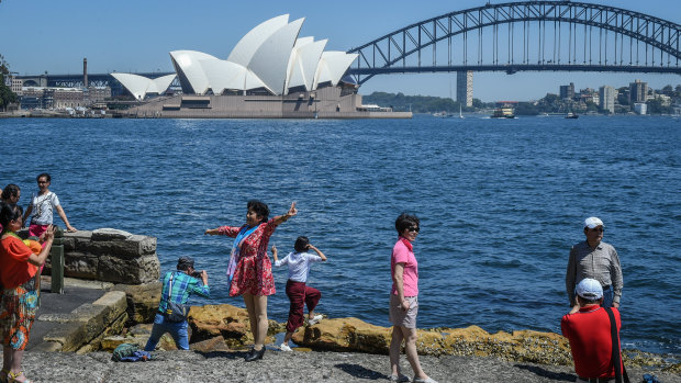 Tourists at Sydney's Mrs Macquarie's Chair.