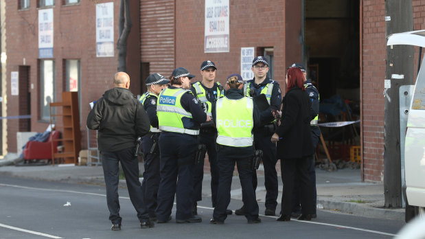 Police outside the red brick building where the remains were found.