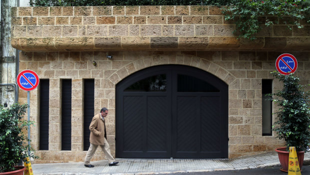 A pedestrian passes the garage at the property of Carlos Ghosn, former head of Nissan and Renault, in Beirut, Lebanon.