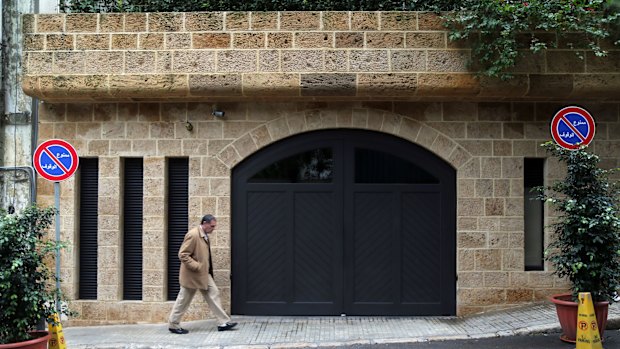 A pedestrian passes the garage at the property of Carlos Ghosn, former head of Nissan and Renault, in Beirut, Lebanon.