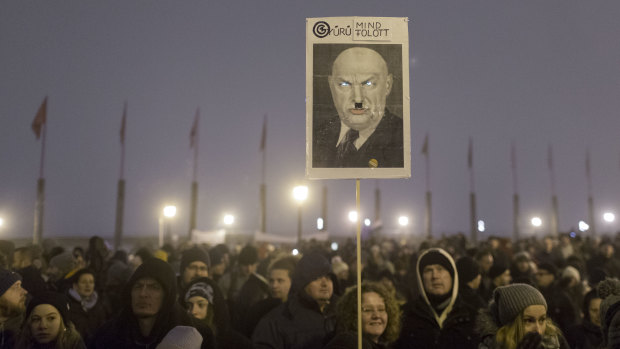 A poster mocking Hungary's Prime Minister Victor Orban is seen during an anti-government march in central Budapest, Hungary.