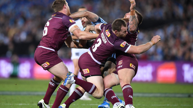 Morgan receives the heavy knock during Game 3 of the State of Origin series  on Wednesday. 