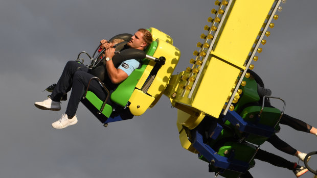 Strap yourselves in: De Belin on a rollercoaster at Luna Park in Melbourne on Sunday.