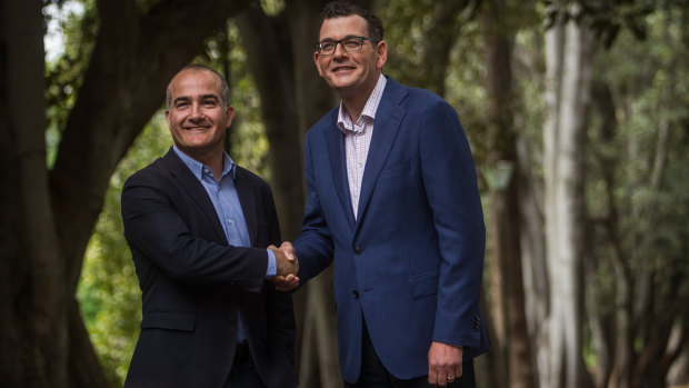 A jubilant re-elected Premier Daniel Andrews (right) on a Sunday stroll with his deputy and friend James Merlino.