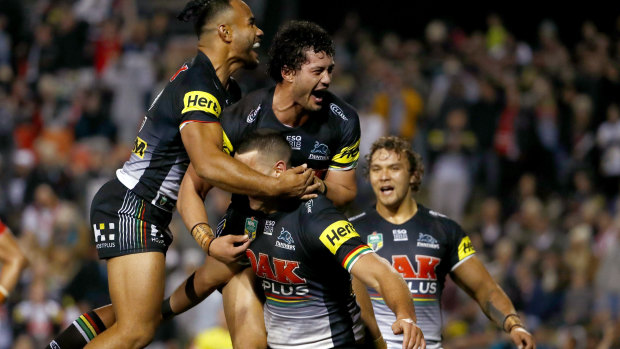 Leading the way: The top-of-the-table clash between Penrith and St George Illawarra on Saturday night was watched by a full house at Panthers Stadium.