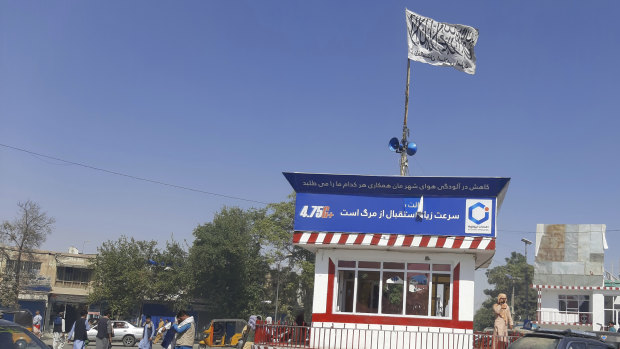 A Taliban flag flies in the main square of Kunduz city after fighting between Taliban and Afghan security forces, in Kunduz, Afghanistan.