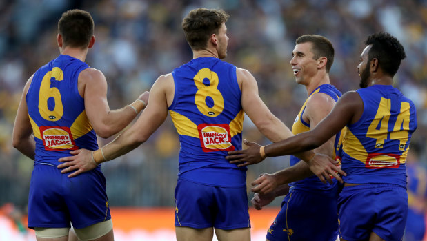 Jack Redden (centre) says West Coast's midfielders are ready to lift for Sunday's derby.