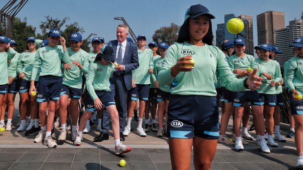Tennis Australia’s Craig Tiley with  Australian Open 2020 ballkid squad members, in Melbourne Park on Tuesday.