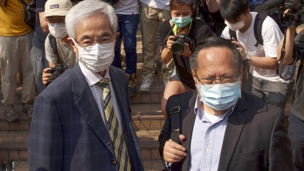 Pro-democracy lawmaker Martin Lee, left, and Albert Ho, right, arrive at a court in Hong Kong earlier this month.