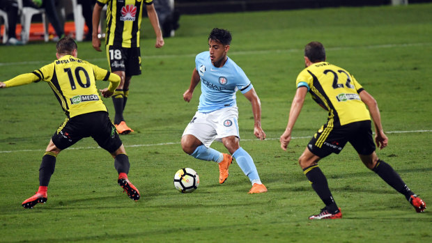 Splitting the defence: Arzani looks for an opening against Wellington. 