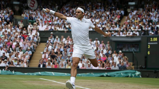 Roger Federer with a backhand return against Marin Cilic in the 2017 Wimbledon final.