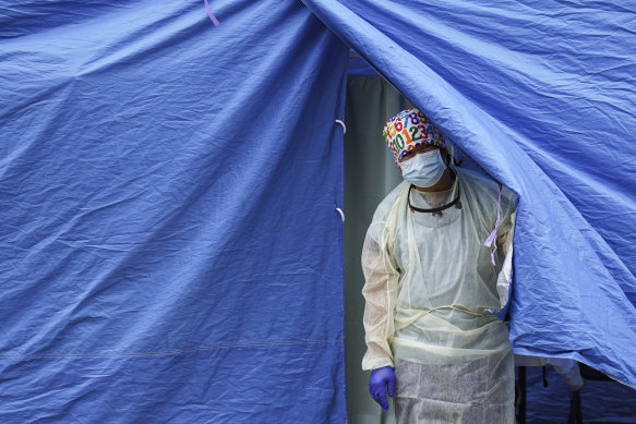 A medical worker at a COVID-19 mobile testing site in the Brooklyn borough of New York.