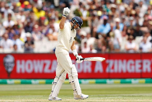 England captain Joe Root punches the air in frustration. 