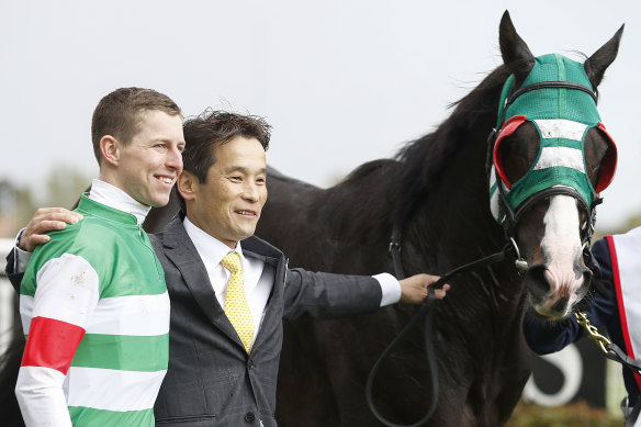 Winning combination: Damian Lane with trainer Hisashi Shimizu and Mer De Glace after the Caulfield Cup.