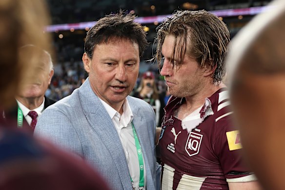 Laurie Daley speaks with Queensland captain Cameron Munster after the match.