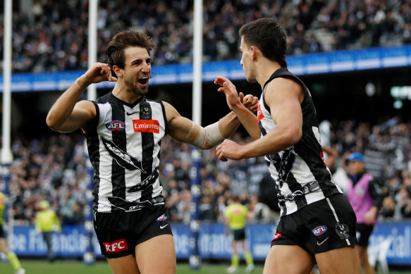 Josh (left) and Nick Daicos celebrate a goal against North Melbourne last year.