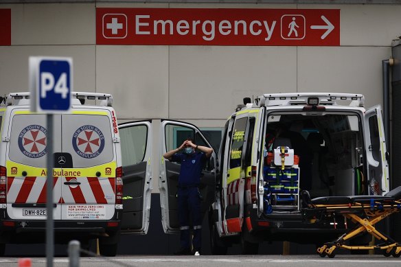 Ambulance paramedics at the Nepean Hospital cleaning and restocking vehicles in preparation for a call on Sunday.