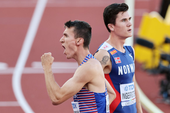 Jake Wightman celebrates his world championships win ahead of Jakob Ingebrigtsen.