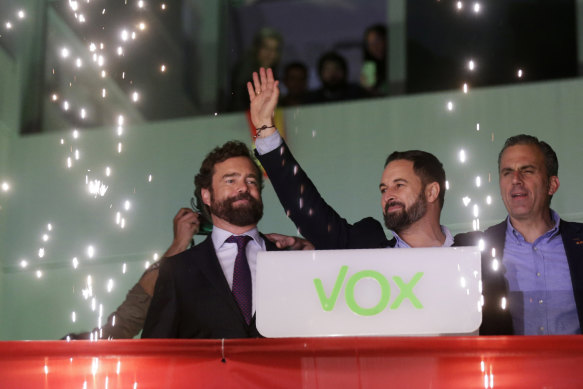 Ultra-nationalist Santiago Abascal waves to supporters after his Vox party polled well.