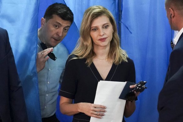 The couple leave a polling booth during a parliamentary election in Kyiv in 2019. 
