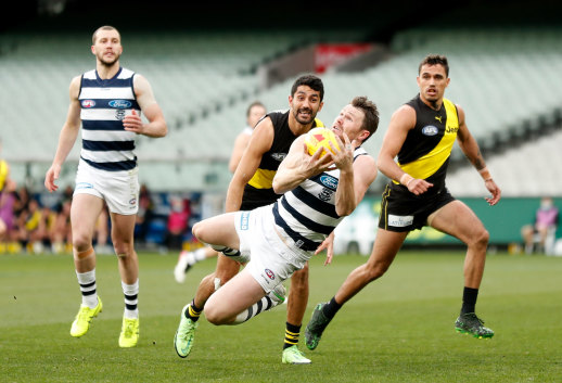 Patrick Dangerfield takes a mark going back with the flight before kicking a goal.