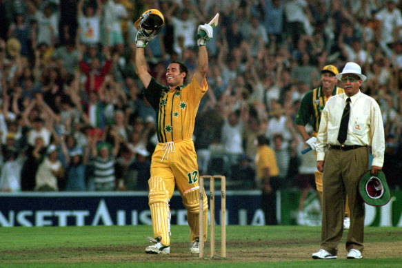 The moment that captivated: Michael Bevan celebrates his four off the last ball to take Australia to victory over the West Indies in an ODI at the SCG in 1996.