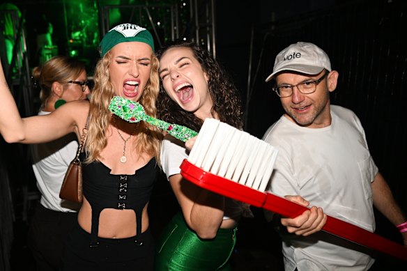 Greens leader Adam Bandt and influencers Abbie Chatfield (centre) and Holly MacAlpine, pose for photos with toothbrushes symbolising the minor party’s plan to put dental care in Medicare. The Greens have taken a bigger bite of the youth vote in recent elections.