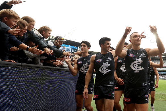 Skipper Patrick Cripps leads the Blues off the field.