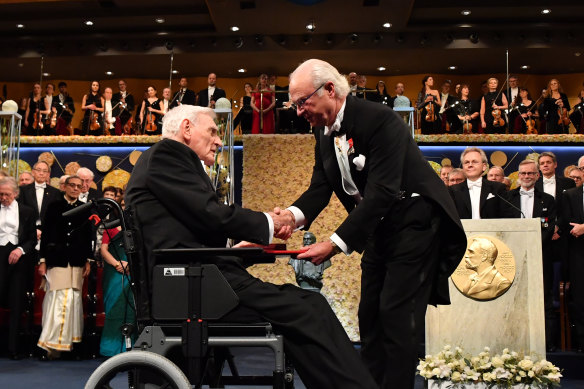 Chemistry laureate John B. Goodenough, left, receives the prize from King Carl Gustaf of Sweden, during the Nobel Prize award ceremony, at the Stockholm Concert Hall, in Stockholm, Monday, 2019.