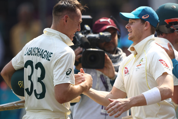 All smiles: Marnus Labuschagne is congratulated by Steve Smith.