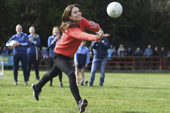 The Duchess of Cambridge plays Gaelic football during their official visit to Ireland earlier this year.
