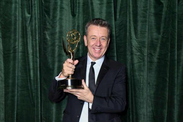 Peter Morgan celebrates winning the Emmy award for outstanding writing for a drama series for The Crown.