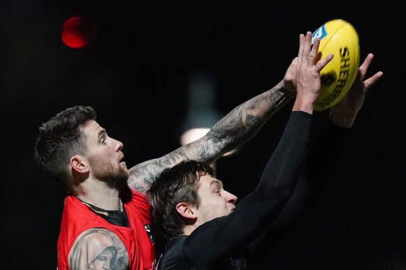 Jeremy Howe and Darcy Moore compete at  training on Friday night.