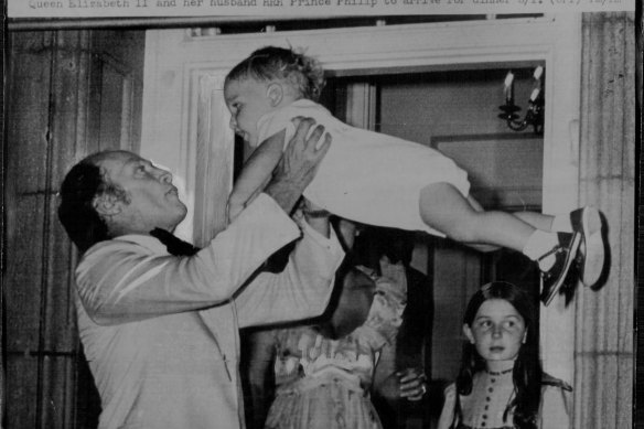 Canadian PM Pierre Elliott Trudeau throws his son - and future Canadian PM - Justin, up in the air as he waited at the front door of his residence to receive Queen Elizabeth II and her husband HRH Prince Philip to arrive for dinner in 1973. 