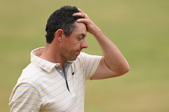 A dejected Rory McIlroy on the 18th green after falling short.