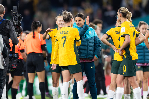 Sam Kerr celebrates with team members after their win.