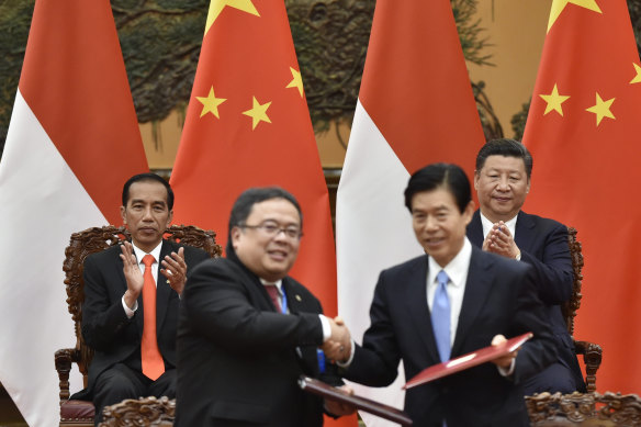 Indonesia’s President Joko Widodo, left, and Chinese President Xi Jinping, applaud during a deal-signing ceremony on the sidelines of the Belt and Road Forum in Beijing in 2017.