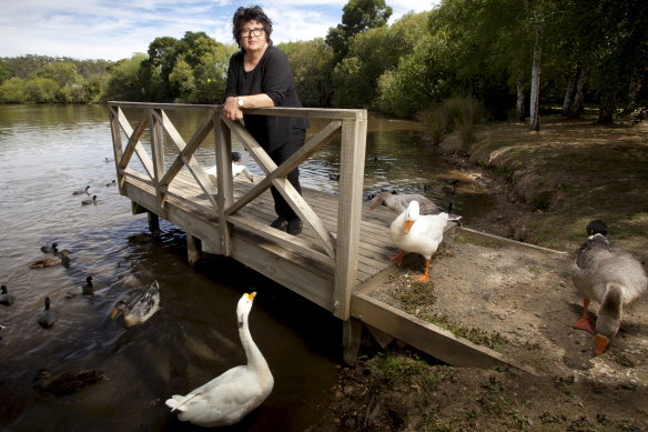 Alla Wolf-Tasker, owner of Lake House in Daylesford, with some of the lake's flock of geese.