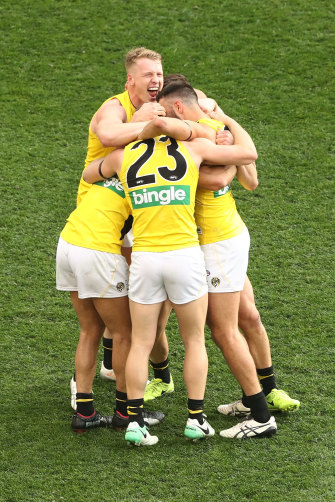 Richmond Tigers players celebrate after defeating the Adelaide Crows in the 2017 AFL Grand Final.
