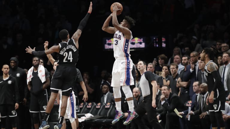 The 76ers' Jimmy Butler nails the game-winning three-pointer against Brooklyn.
