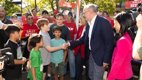 The PM meets a young constituent in his seat of Grayndler.