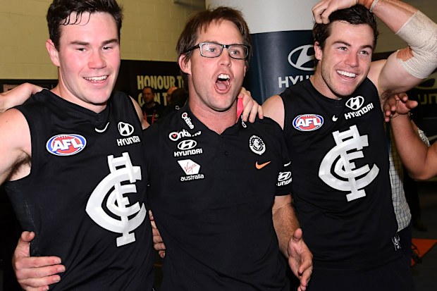 David Teague (centre) enjoys strong support from Carlton players.