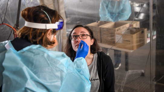 Amanda Heriford being tested in the walk-in coronavirus testing station Northern Health in Epping, Victoria.
